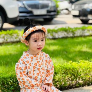 Bộ áo dài cách tân bé gái phối nơ Áo dài cách tân màu cam cho bé gái